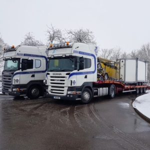 Skytrux lorries in snowy scene