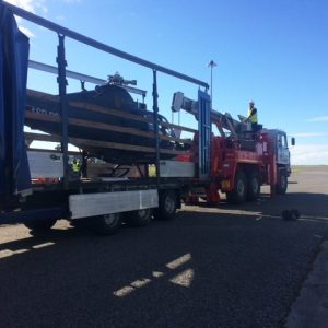 Helicopter being maneuvred by trailer